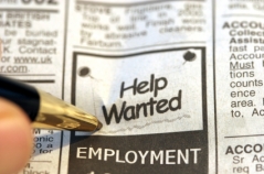 Pen on a help wanted ad in a newspaper